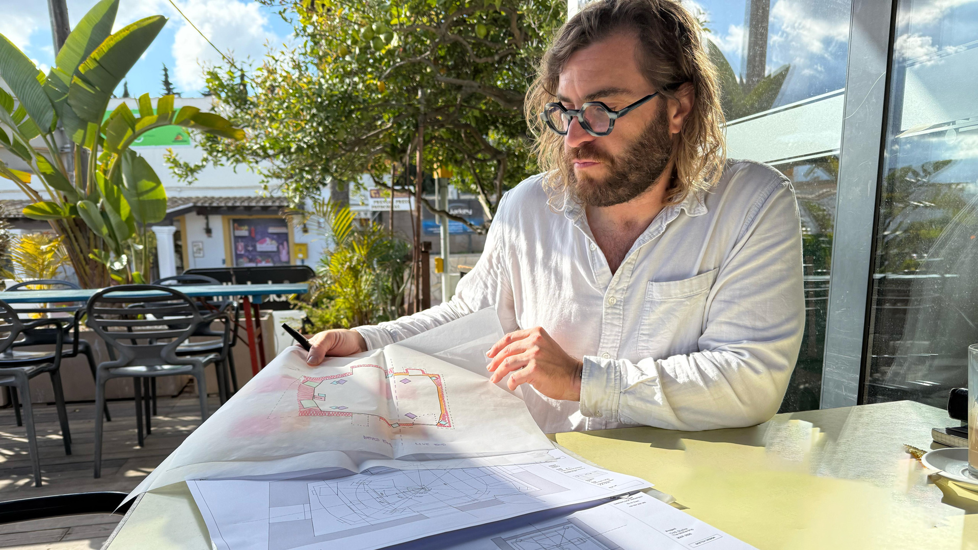 Alasdair W Grant reviewing drawings — creative consultancy
